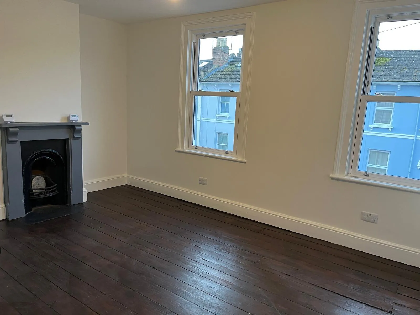 Refitted & redecorated room, including walls, windows & floor.