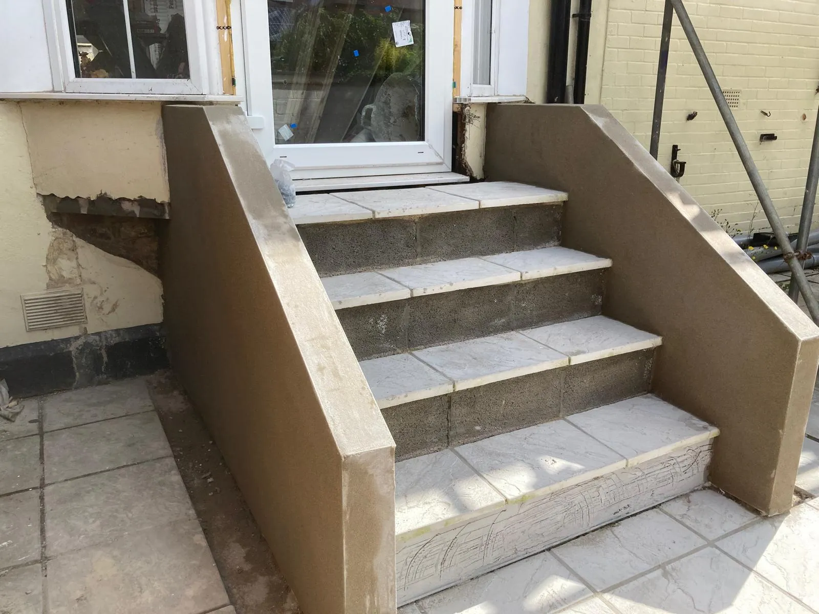 External steps freshly rendered with new tiled treads