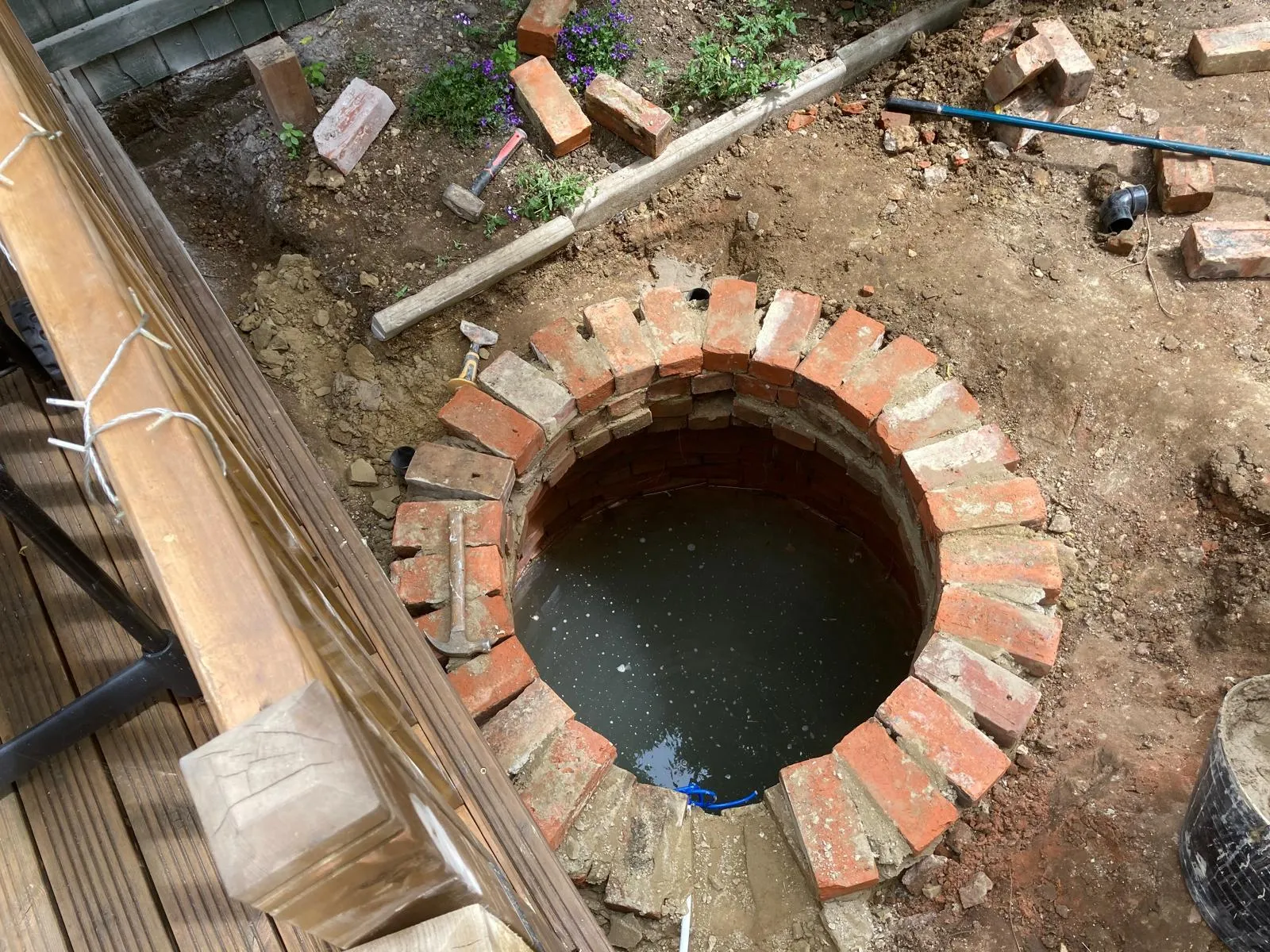 Existing brickwork pond area prior to landscaping