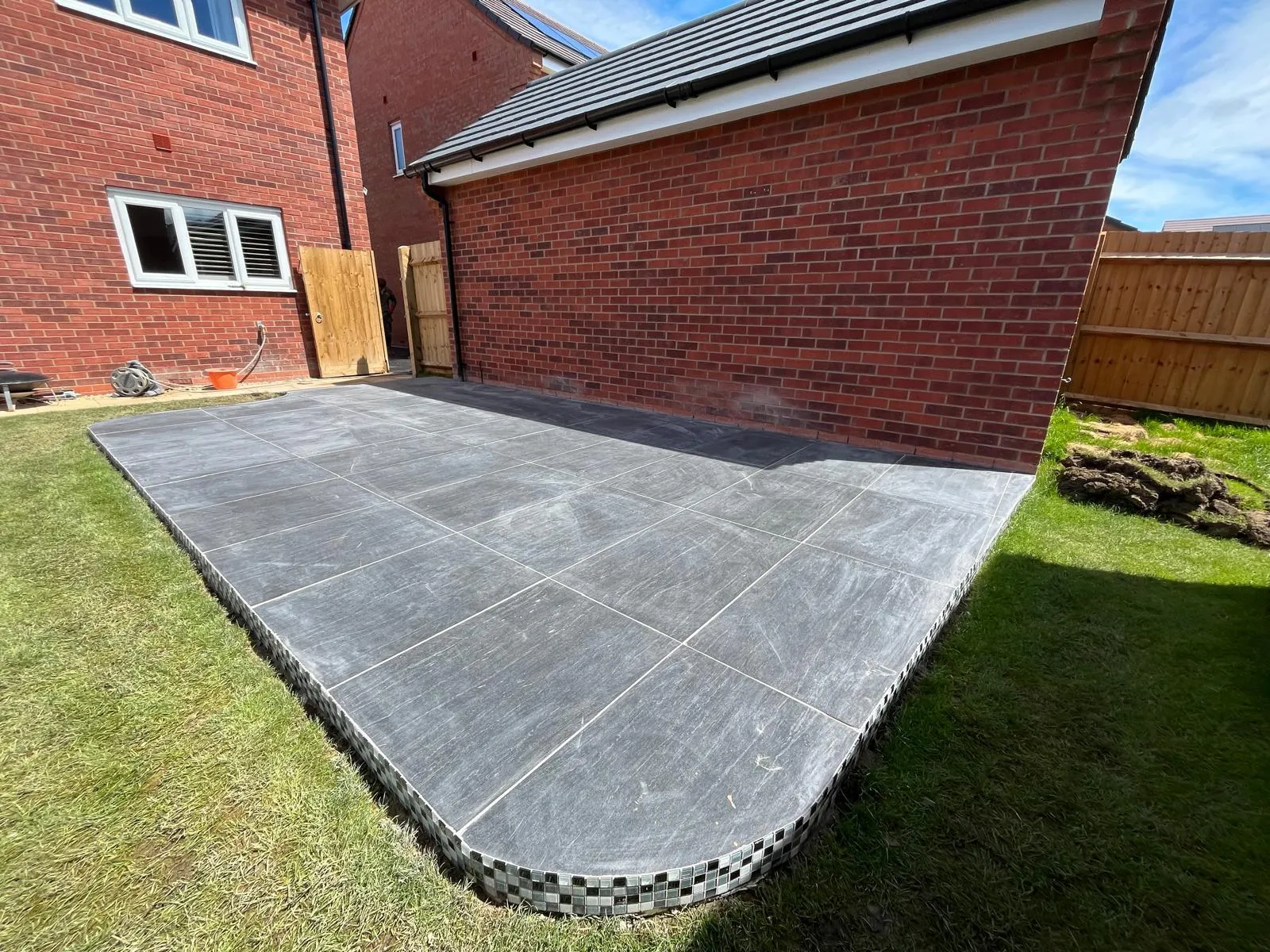 Turfed garden with new fencing and shrub borders