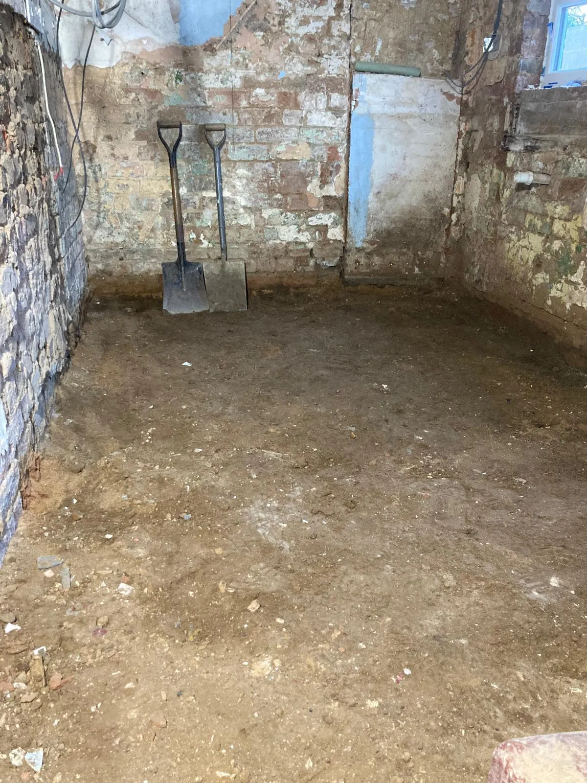 Kitchen ripped out and subfloor removed and walls prepped back to brickwork
