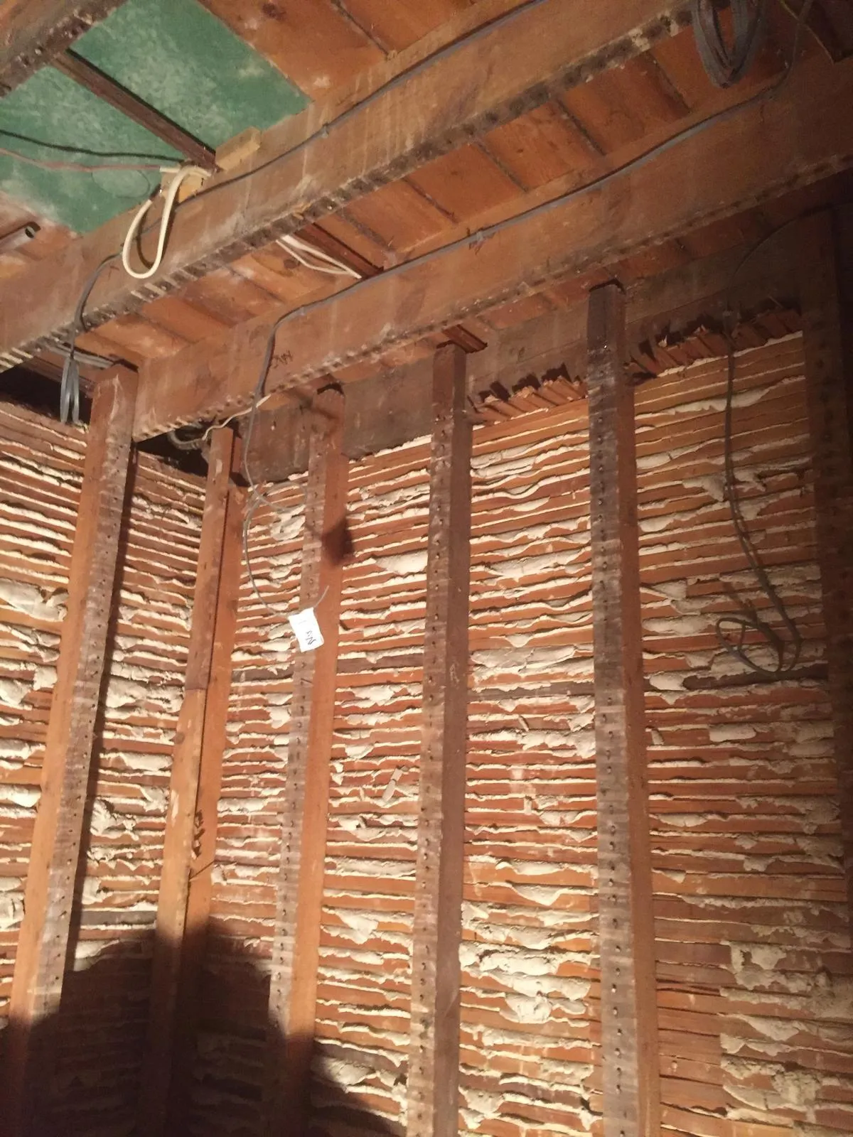 Walls taken back to old studwork, ready for insulation and tanking