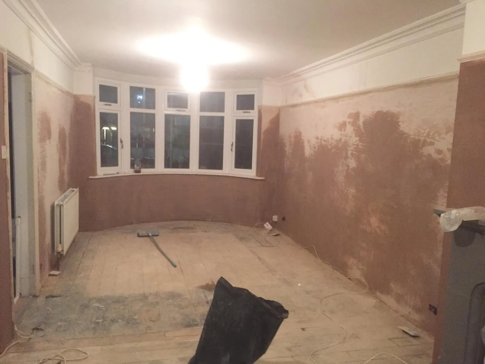 Plasterer hand applied to interior wall