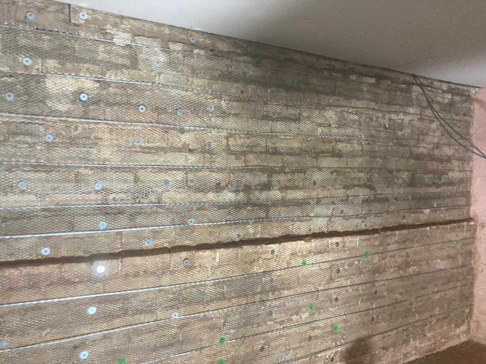 Basement ceiling with recessed downlights and fresh plasterwork